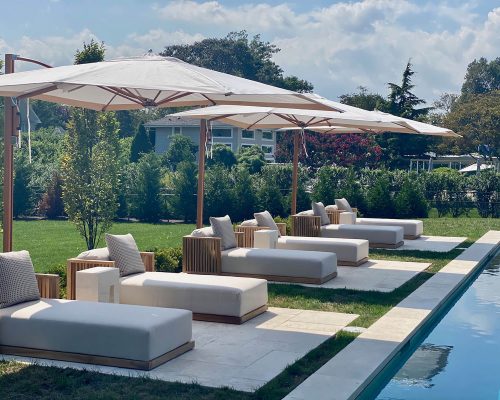 Luxury residence designed by Lisa Cohen of Modern/Vintage Interiors and furnished by Portside Luxury featuring pieces by Tuuci & Il Giardino Di Legno.