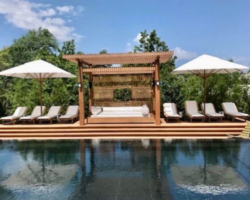 Luxury residence designed by JL Ramirez and furnished by Portside Luxury featuring pieces by Manutti & Bambrella.