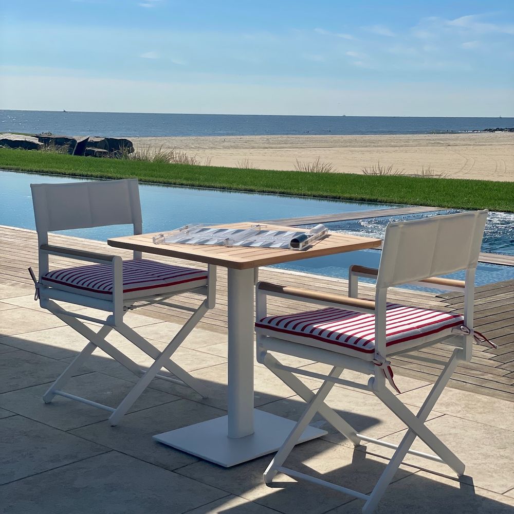 Beachfront Dining. Director’s chairs above the sand.